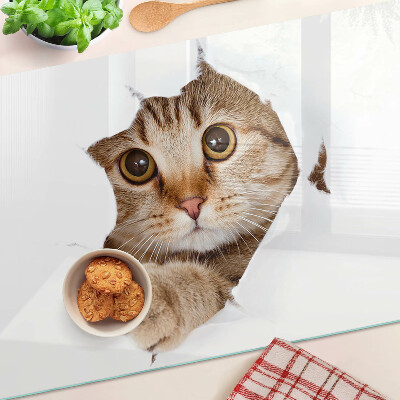 Tabla para cortar Un gato saliendo de un agujero