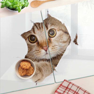 Tabla para cortar Un gato saliendo de un agujero