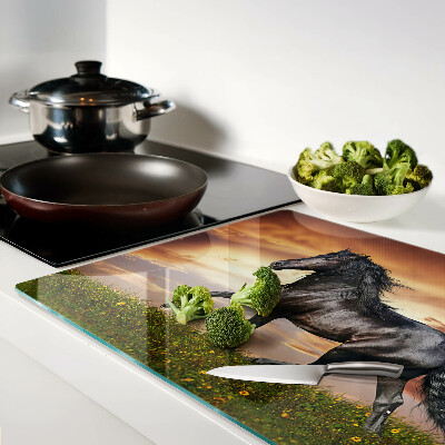 Tabla de cocina Un caballo con el sol poniente como telón de fondo