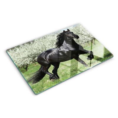 Tabla de cortar Caballo negro en el prado