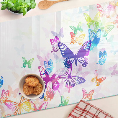 Tabla para cortar Un motivo de mariposas coloridas volando.