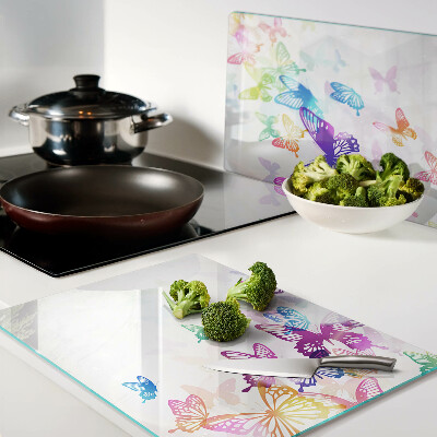 Tabla para cortar Un motivo de mariposas coloridas volando.