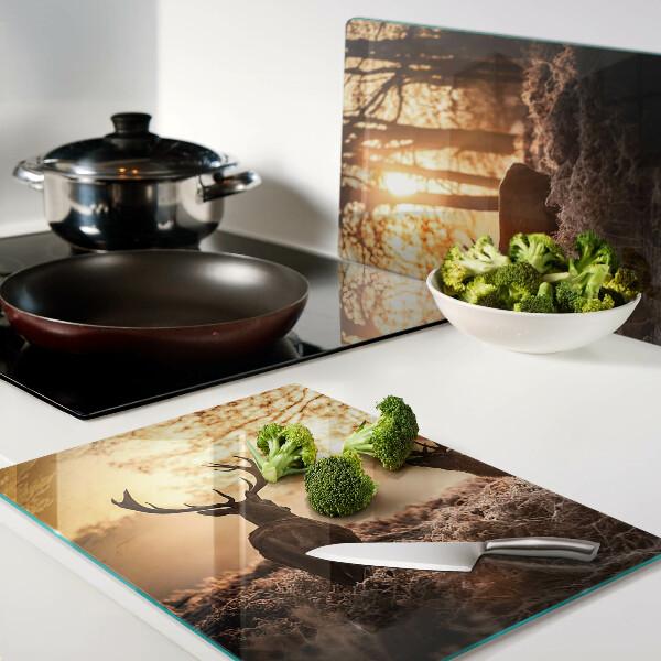 Tabla de cortar Ciervos en el bosque al atardecer