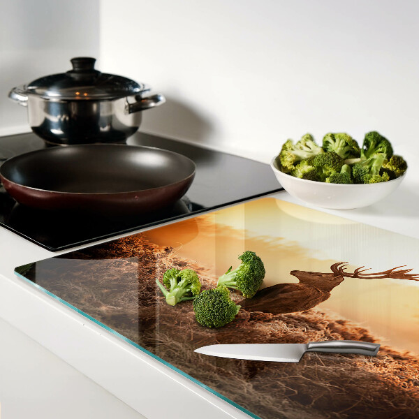 Tabla de cocina Ciervos contra el fondo del atardecer