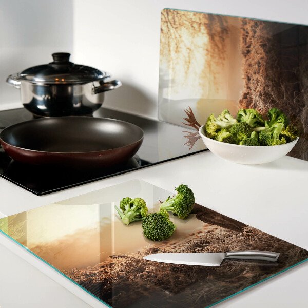 Tabla de cocina Ciervos contra el fondo del atardecer