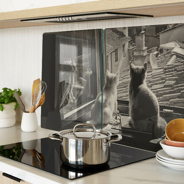 Szklana deska kuchenna Koty przy oknie
