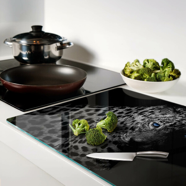 Tabla de cortar de cristal Pantera izquierda con ojos azules.