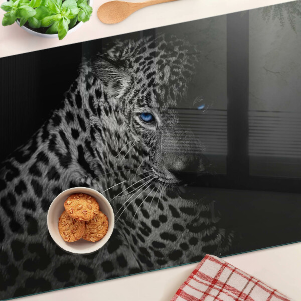 Tabla de cortar de cristal Pantera izquierda con ojos azules.