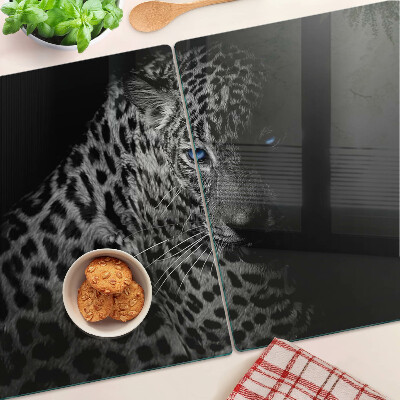 Tabla de cortar de cristal Pantera izquierda con ojos azules.