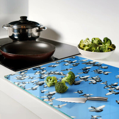 Tabla de cortar Palomas volando en el cielo