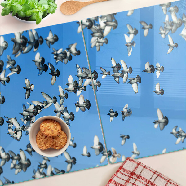 Tabla de cortar Palomas volando en el cielo