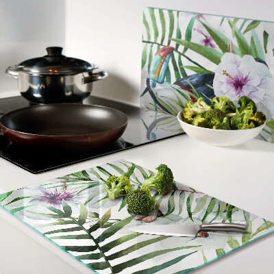 Tabla de cortar Motivo tropical con pájaros y plantas.