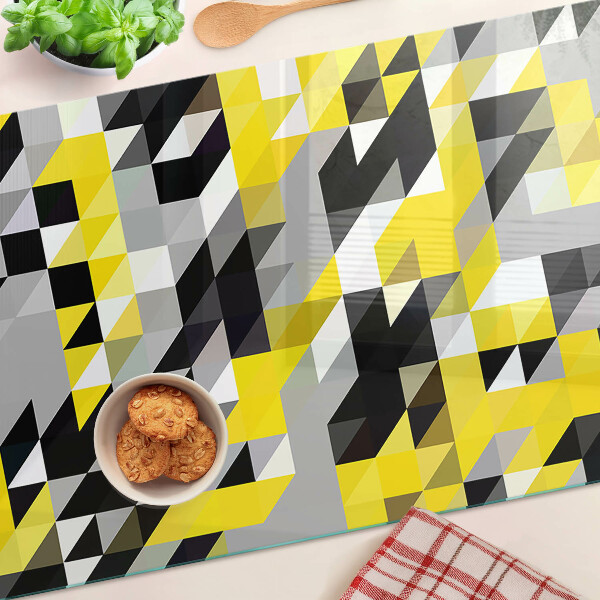 Tabla de cortar Geometría en tonos amarillos y negros.
