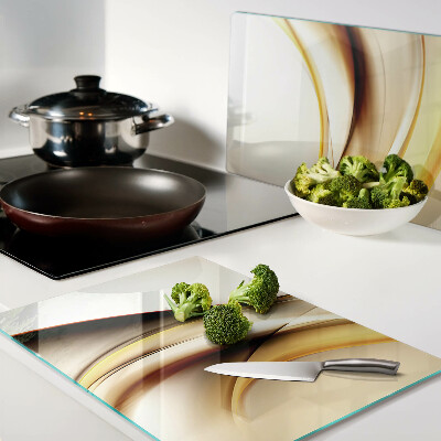 Tabla de cortar de cristal Ondas abstractas en tonos dorados