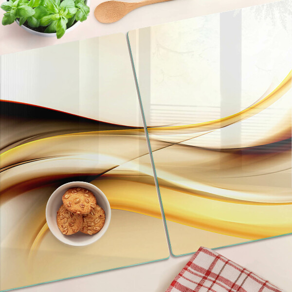 Tabla de cortar de cristal Ondas abstractas en tonos dorados