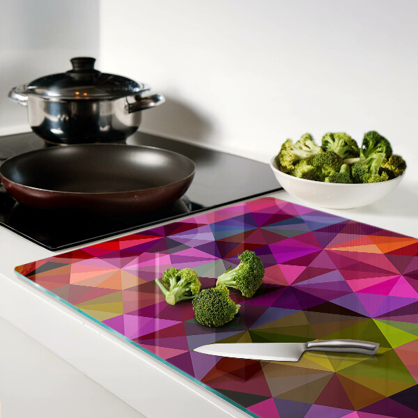 Tabla de cortar de cristal Geometría en tonos rosa y morado.