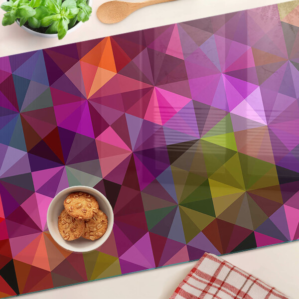 Tabla de cortar de cristal Geometría en tonos rosa y morado.