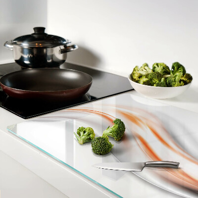 Tabla para cortar Ondas en tonos naranja y gris.