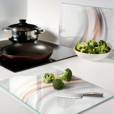 Tabla para cortar Ondas en tonos naranja y gris.