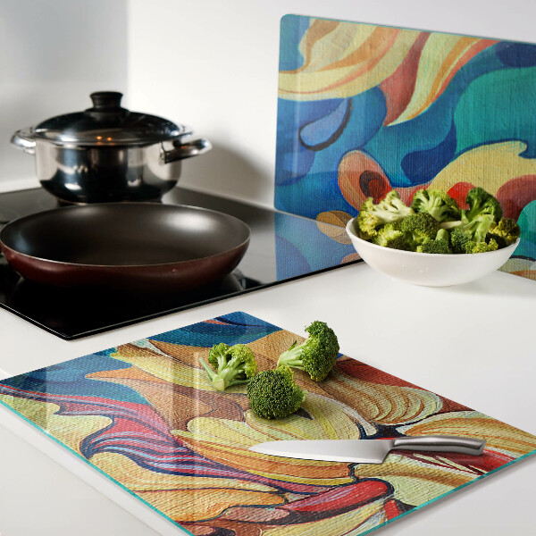 Tabla de cortar de cristal Flores de colores sobre un fondo abstracto