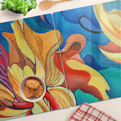 Tabla de cortar de cristal Flores de colores sobre un fondo abstracto