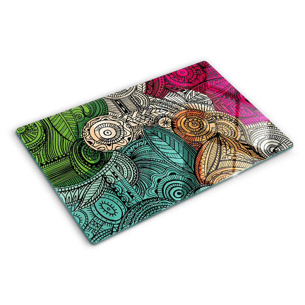 Tabla de cortar Motivo de mandala con patrones coloridos.
