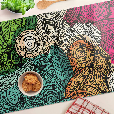 Tabla de cortar Motivo de mandala con patrones coloridos.