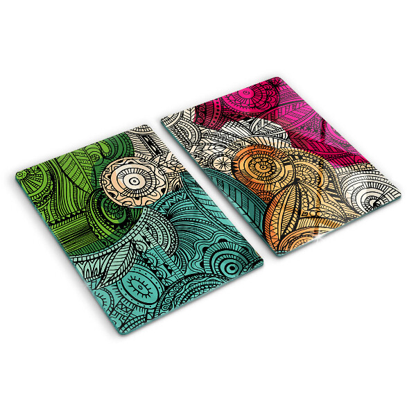 Tabla de cortar Motivo de mandala con patrones coloridos.