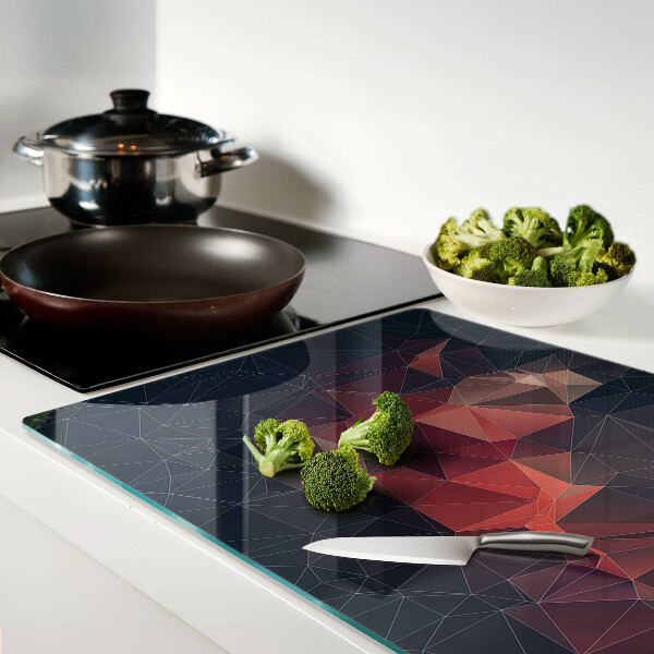 Tabla de cortar de cristal Geometría abstracta en tonos rojos.