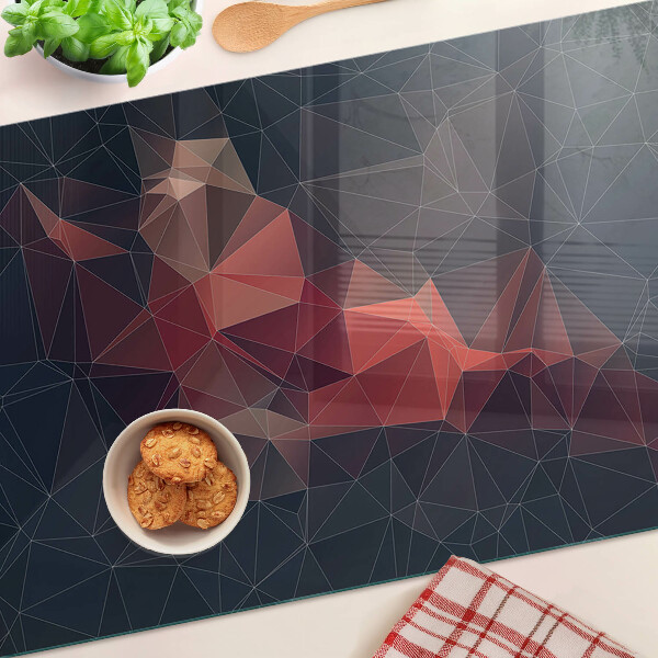 Tabla de cortar de cristal Geometría abstracta en tonos rojos.