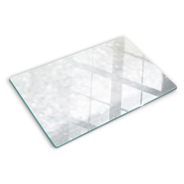 Tabla de cortar de cristal Bokeh brillante con efecto de luz
