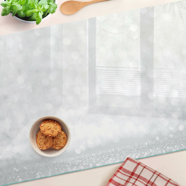 Tabla de cortar de cristal Bokeh brillante con efecto de luz