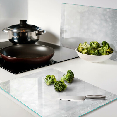 Tabla de cortar de cristal Bokeh brillante con efecto de luz