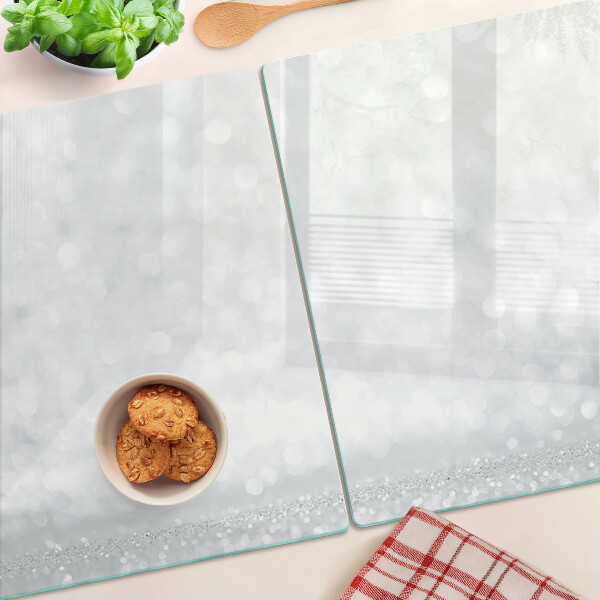 Tabla de cortar de cristal Bokeh brillante con efecto de luz