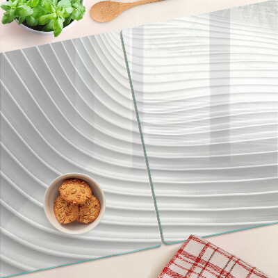 Tabla de cortar de cristal Ondas y líneas en tonos de gris.
