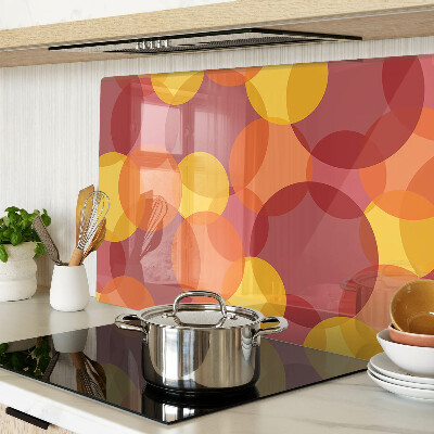 Tabla de cortar de cristal Círculos coloridos en tonos cálidos.