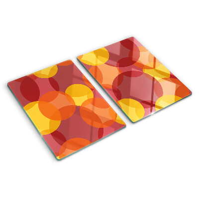 Tabla de cortar de cristal Círculos coloridos en tonos cálidos.