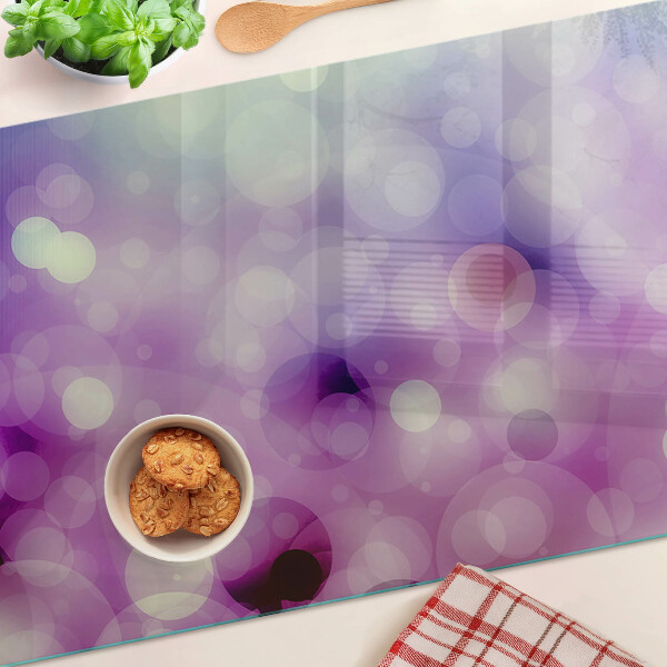 Tabla de cortar Bokeh en tonos morados y rosas