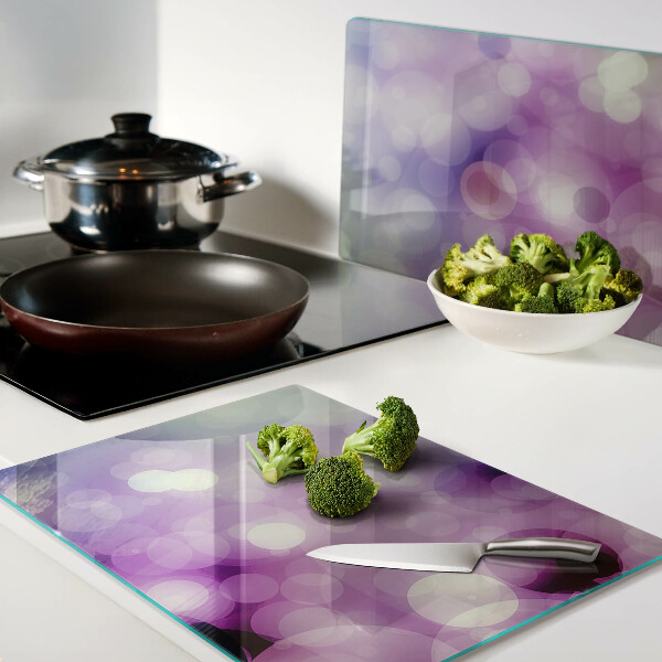 Tabla de cortar Bokeh en tonos morados y rosas