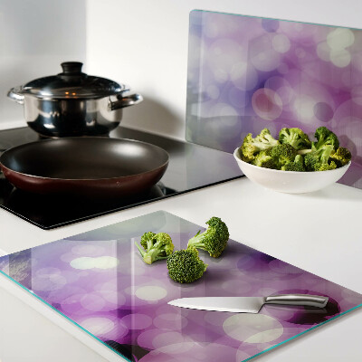 Tabla de cortar Bokeh en tonos morados y rosas