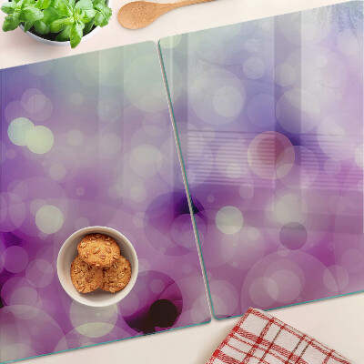Tabla de cortar Bokeh en tonos morados y rosas