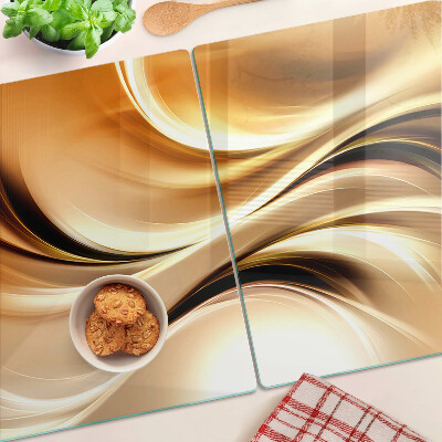 Tabla de cortar de cristal Ondas abstractas en tonos dorados