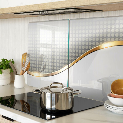 Tabla de cortar de cristal Una ola dorada sobre un fondo de puntos.