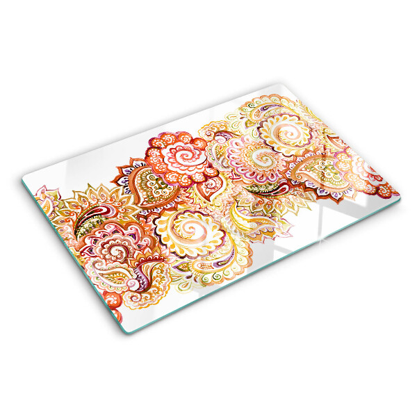Tabla de cortar de cristal Motivo paisley en tonos rojos y dorados.