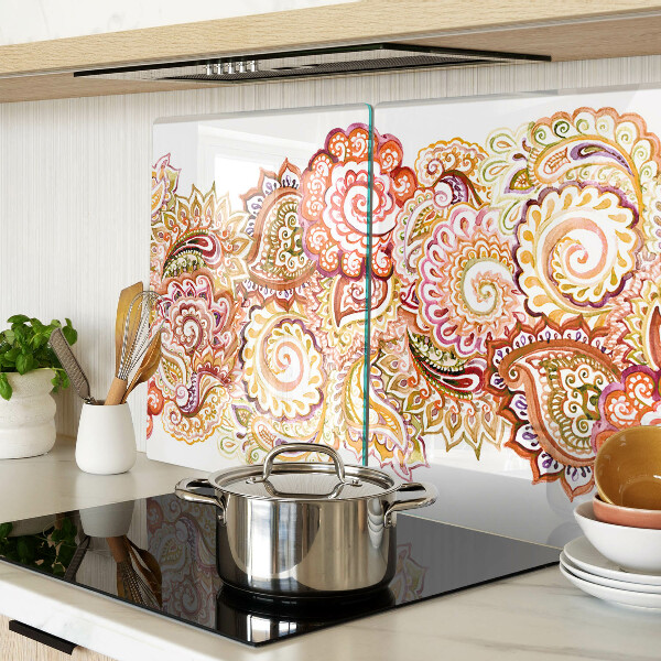 Tabla de cortar de cristal Motivo paisley en tonos rojos y dorados.