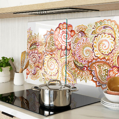 Tabla de cortar de cristal Motivo paisley en tonos rojos y dorados.