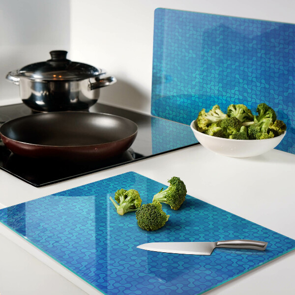 Tabla para cortar Un patrón ondulado en tonos azules.