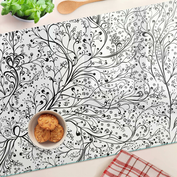 Tabla de cocina Un patrón de planta con ramas delicadas.