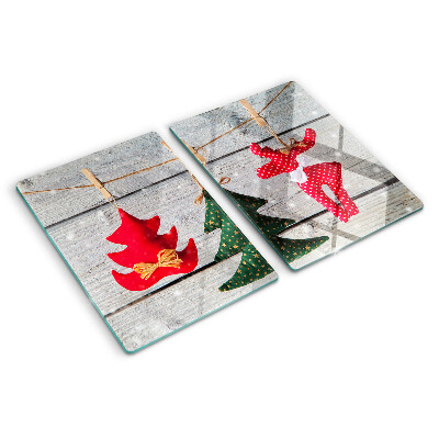 Tabla de cortar Adornos navideños sobre un fondo de madera.