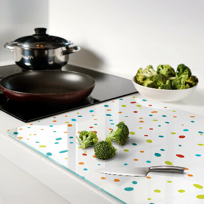 Tabla de cocina Puntos de colores sobre un fondo blanco